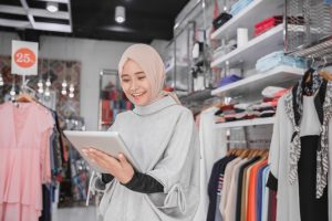 muslim-fashion-boutique-owner-with-tablet_8595-3340